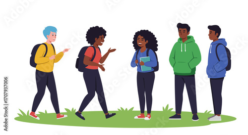 A diverse group of young students with backpacks talking and socializing together outdoors on the grass.