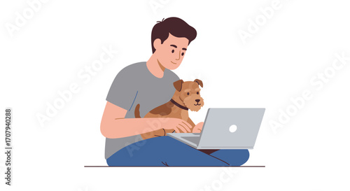 A young man sits cross-legged on the floor with his cute terrier dog on his lap while working on a laptop computer.