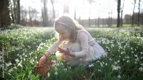 Six year old girl playing egg hunt on Easter
