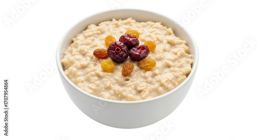 Isolated bowl of hot oatmeal porridge with raisins and cherries perfect healthy breakfast