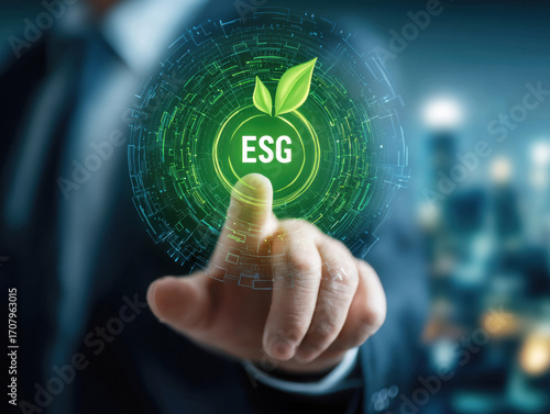 A businessman in a suit touches a digital interface displaying the ESG symbol, representing a focus on sustainability and corporate responsibility in a modern corporate environment.
