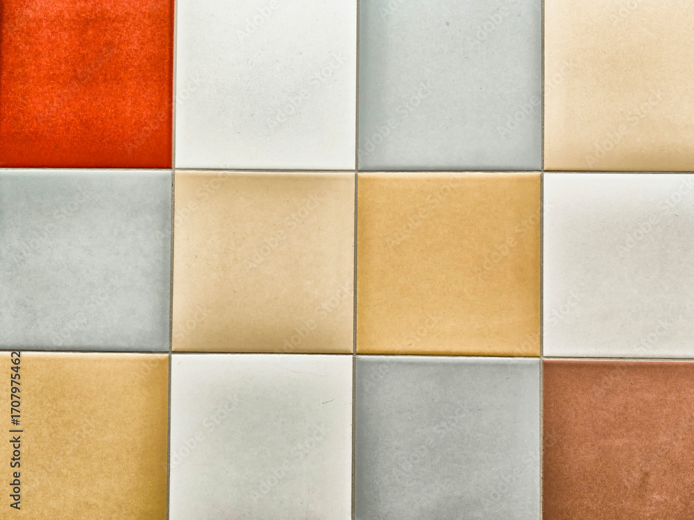 Fototapeta premium Colorful ceramic tiles arranged in a stylish pattern, perfect for interior decoration and design projects