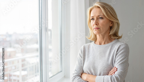 Serious middle aged woman standing with arms crossed Free Download Serious middle aged woman standing with arms crossed - GFXLoad