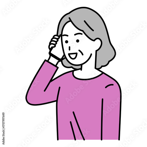 スマートフォンで話す年配の女性