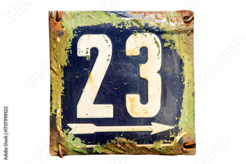 Weathered grunge square metal enameled plate of number of street address with number 23 isolated on white background