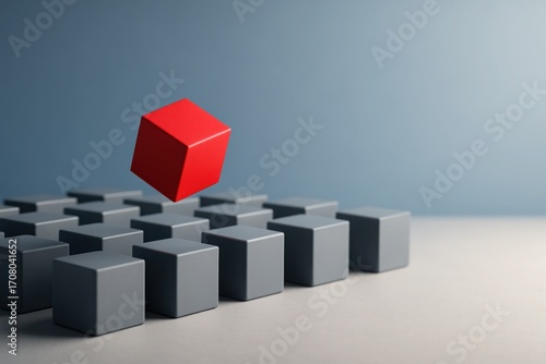 Red cube floating above uniform gray cubes on neutral background symbolizing leadership individuality innovation and standing out concepts