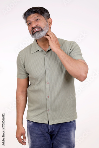 Indian man skin problem. Man with rash suffering from monkeypox virus on white background. Man Itching Problem.  Indian man scratching neck on white background