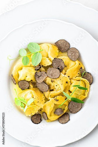 Wallpaper Mural Black truffle ravioli. Italian autumn and winter recipes. Autumn gourmet cuisine of Piedmont, Northern Italy, France, Spain, close up  Torontodigital.ca
