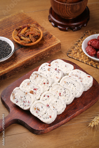 Chinese Eight Treasures Poria Cake Slices Traditional Canton Dim Sum Dessert on Wooden Serving Board