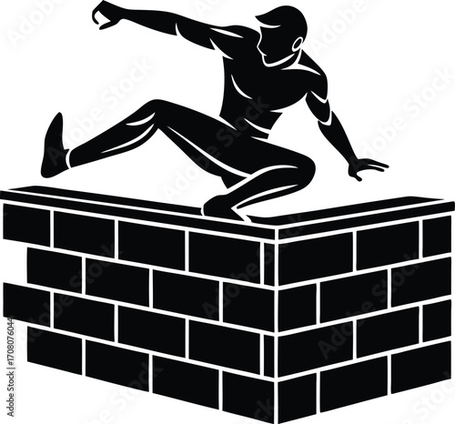 Silhouette of a Man Jumping Over a Brick Wall parkour