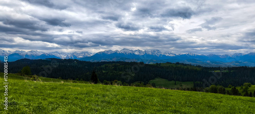 Panoramic view of the Tatra Mountains in Poland. View of the mountains and the fields in front of them.