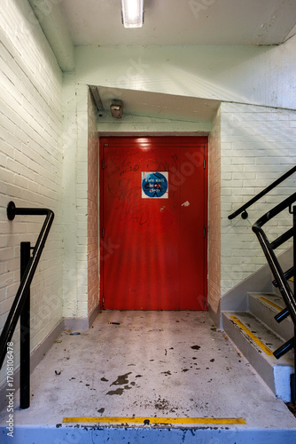 London UK, September 16 2025, Red Painted Internal Fire Escape Door