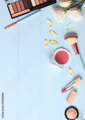 Wallpaper Mural cosmetics and flowers on a colored background top view.. Vertical photo format Torontodigital.ca