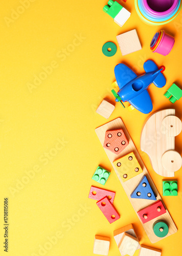 Wallpaper Mural Set of different children's toys on a colored background top view.. Vertical photo format Torontodigital.ca