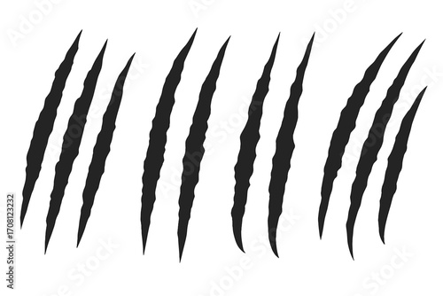 Claw scratch marks vector set. Animal claws silhouette. Tiger, bear, or monster rip marks. Slashed and torn effect illustration. Damage texture for design element.