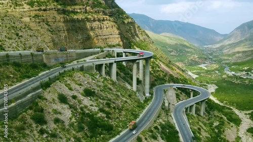 A panoramic view of a steel bridge constructed in the mountains