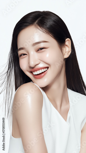 Joyful woman smiling with long hair in bright setting during daytime