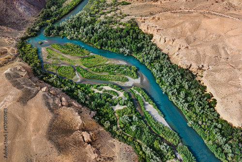 Bilde på lerret Aerial view of a beautiful river flowing through a canyon, creating a stunning c