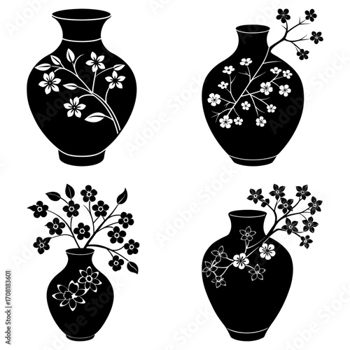 Collection of four black vases decorated with white floral designs in a square arrangement style