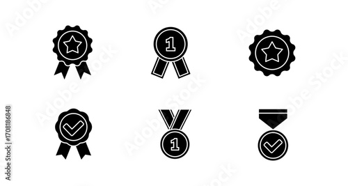 Set of black silhouette award icons with medals and badges for achievement and recognition