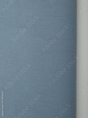 Light blue dense fabric, ironed, the texture of the fabric is visible