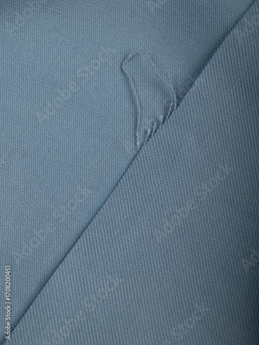 Light blue dense fabric, ironed, the texture of the fabric is visible