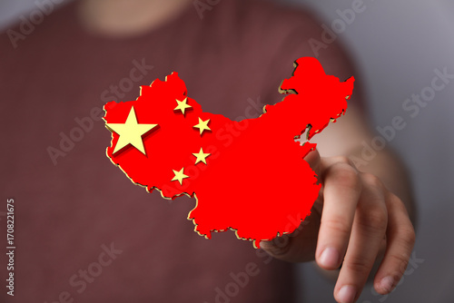 Hand holding 3D China map. ...