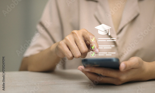 Mobile online education checklist with graduation cap and digital learning app