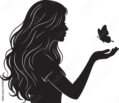 Silhouette of a woman with long flowing hair releasing a butterfly from her hand girl