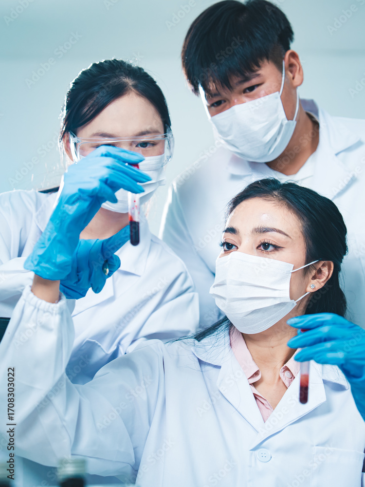 Φωτογραφία A female scientist examines a blood sample with focus and precision, representing dedication to uncovering answers in disease, DNA, and science through teamwork and innovation