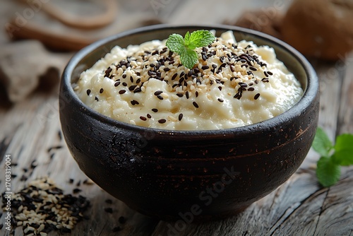 Rice pudding with fresh mint garnish high resolution picture