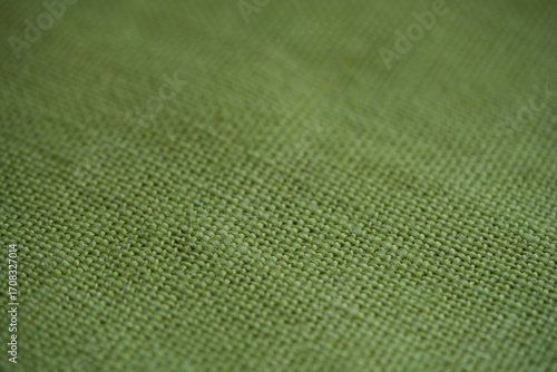 light green bfabric canvas burlap  pistachio burlap fabric texture – close-up background top view 