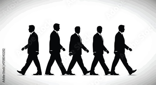 Silhouettes of business people walking in a row representing teamwork and success