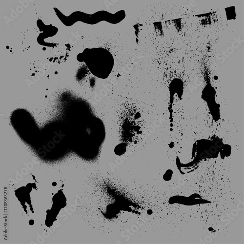 Black ink splatters and spray paint effects on a gray background.