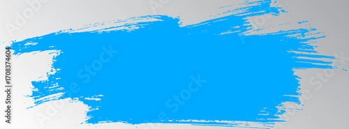 Grunge grainy blue brush stroke with spray texture. Hand drawn distress damaged vintage banner with zigzag bold line. Rough thick brush stroke texture. Spray paint effect vector background.