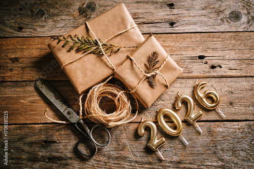 Decorative Gift Wrapping Setup With Festive Candles for New Year Celebration