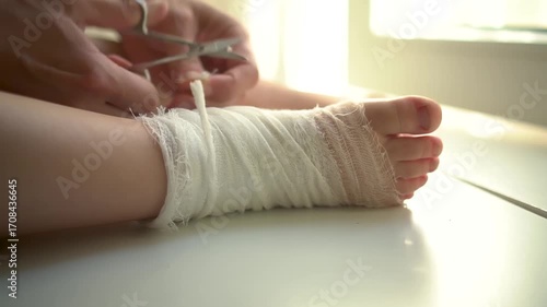 Wallpaper Mural Detailed shot of young child's bandaged foot and ankle during medical dressing change procedure. Healthcare, injury treatment concept. Torontodigital.ca