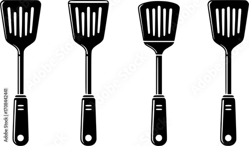 A sleek black spatula with ventilation slots and a hanging hole on a white backdrop