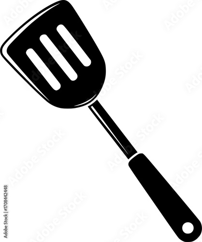 A sleek black spatula with ventilation slots and a hanging hole on a white backdrop