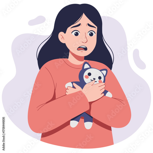 Young woman holding stuffed animal and looking worried  