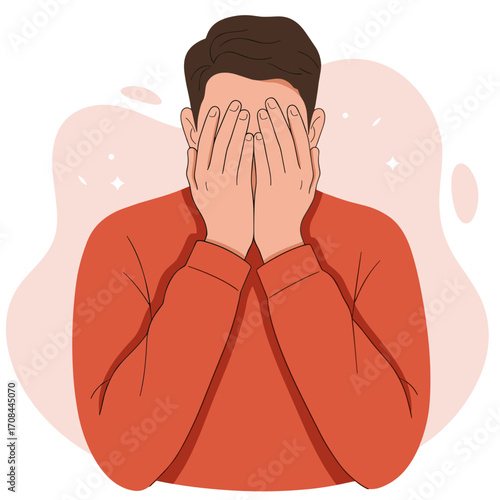 Young man covering his face with hands and showing distress  