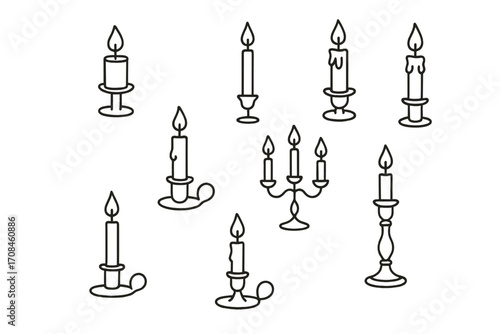 Different types of candles with various designs and styles arranged on a plain background