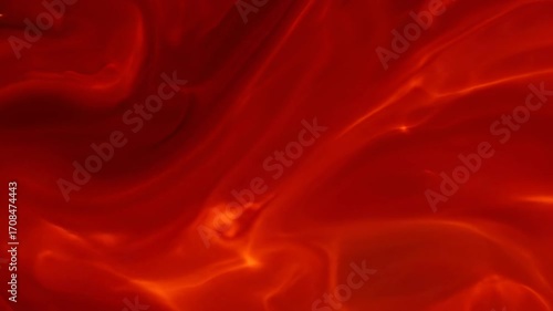 Abstract red and orange liquid light flares pulse and flow like slow-motion lava in a mesmerizing, seamlessly looping video dynamic, soft, motion