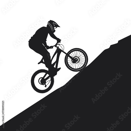 Mountain biker performing a wheelie silhouette isolated on white background