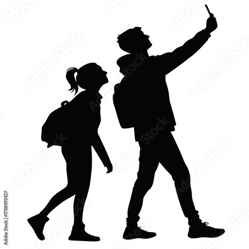 Young couple taking a selfie silhouette isolated on white background