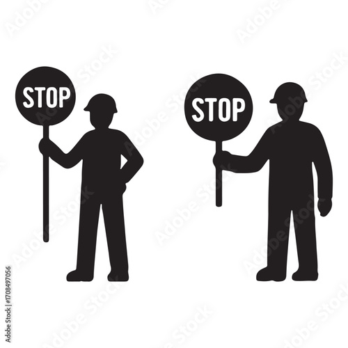 Two silhouetted workers holding stop signs for safety and traffic control