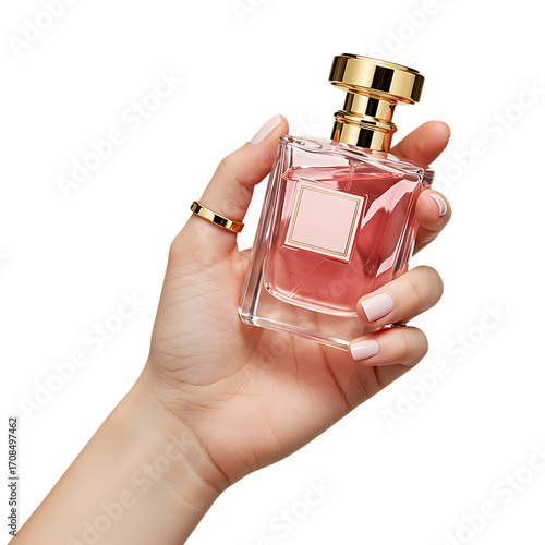 Hand holding a bottle of pink perfume with gold cap and label on transparent background