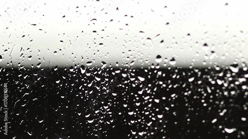 Black and White Raindrops. Abstract Water Droplets on a Background. A Detailed Macro of Rain Droplets. Falling on a Black and White Background. Autumn melancholy backdrop