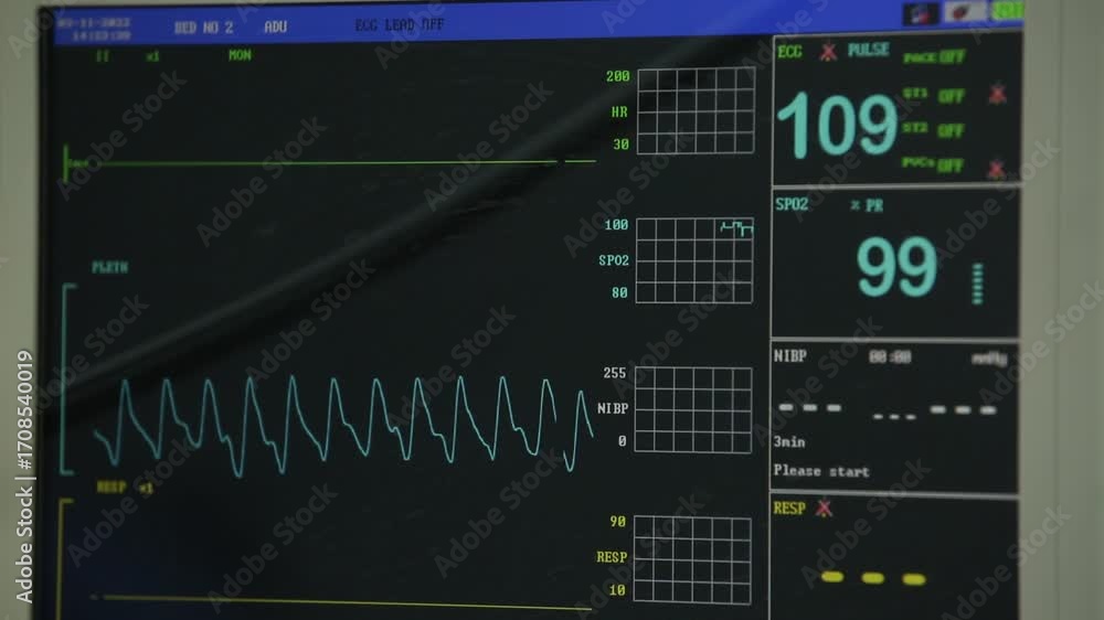 A close-up shot of a modern medical patient monitor displaying vital ...