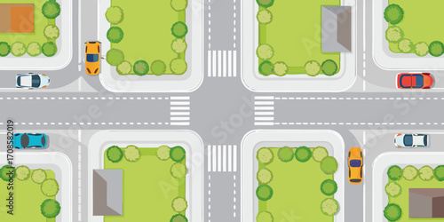 Aerial view of a suburban intersection with cars houses and trees